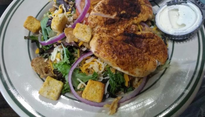 Grilled chicken salad with mixed greens—perfect alongside our burgers, beer, or shakes.