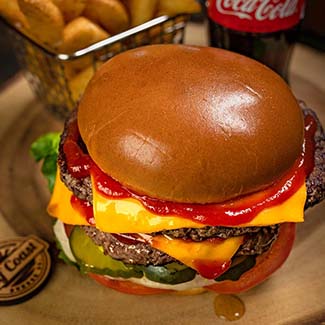 Cheeseburger with fries and a Coke—classic flavors from Gulf Coast Burger Company, Florida.