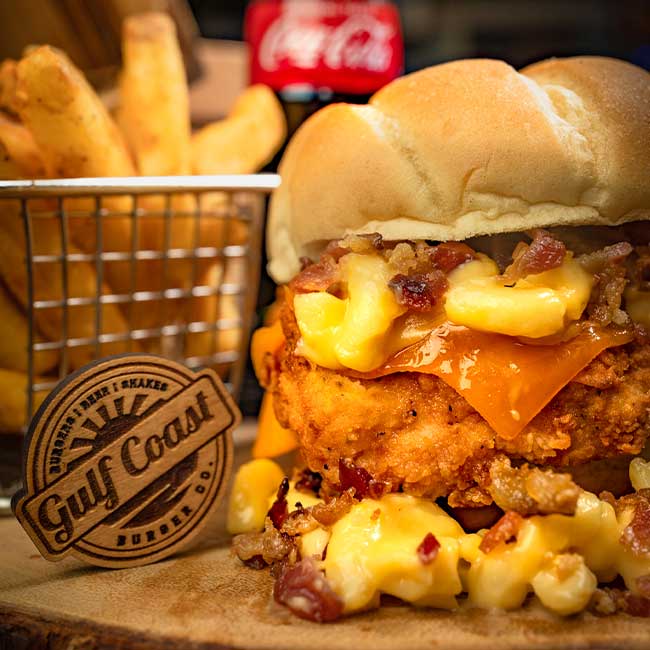 Chicken sandwich, mac & cheese, bacon, cheddar, fries, Gulf Coast Burger Company logo in Florida.